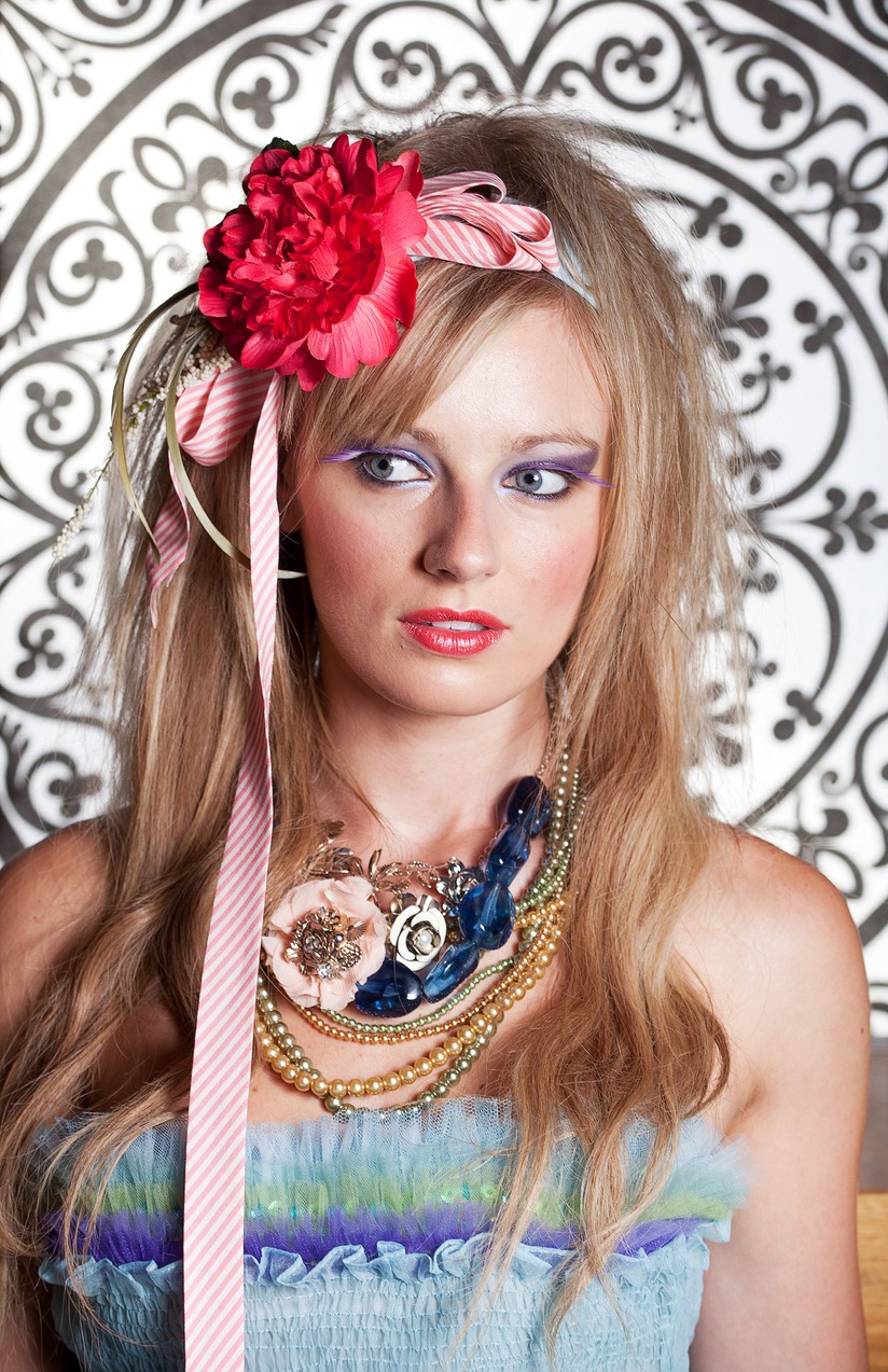 A woman adorn with bold accessories with 2000s vibes dress