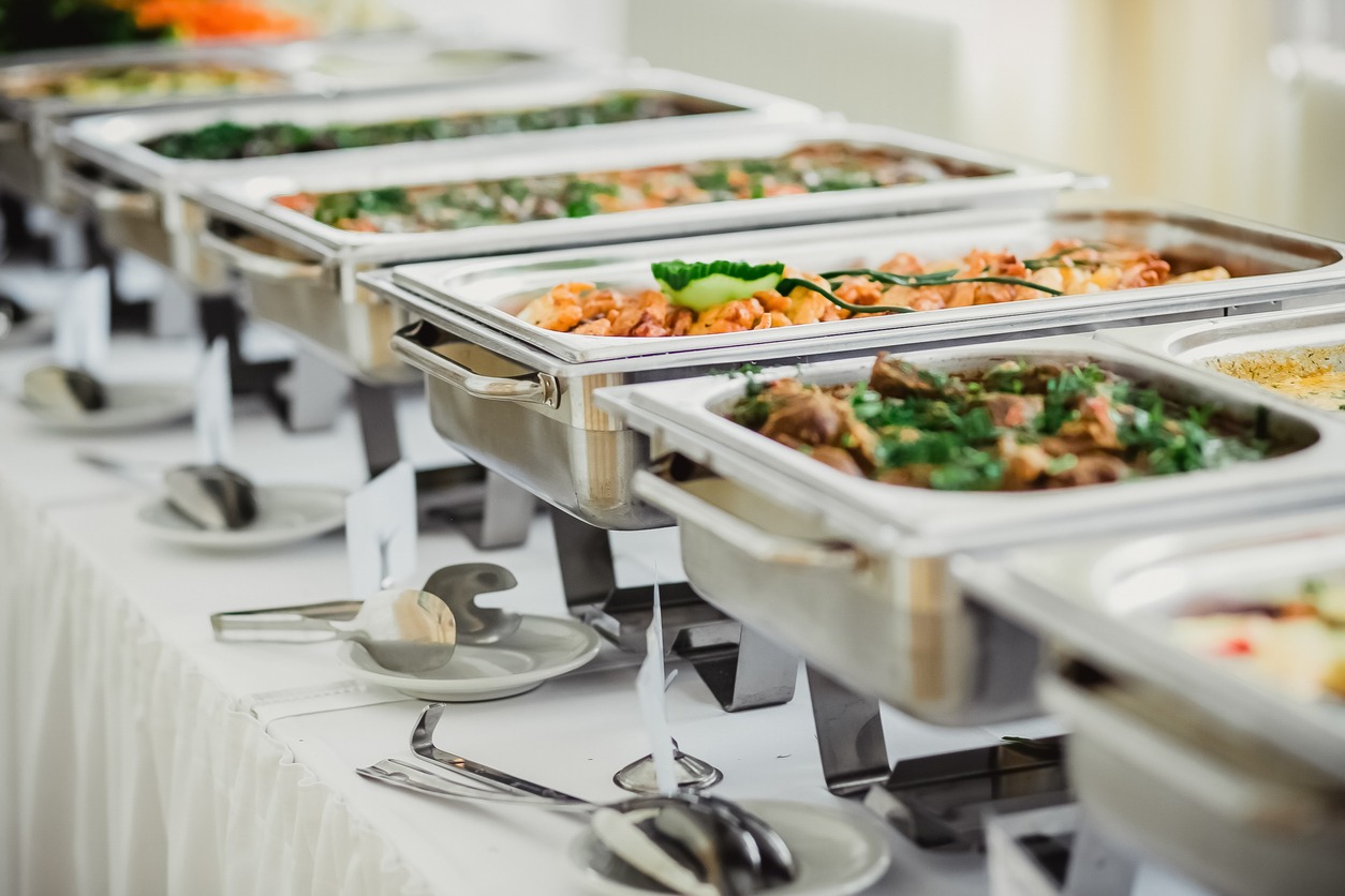 Beautifully decorated catering banquet mirror table with different food snacks and appetizers