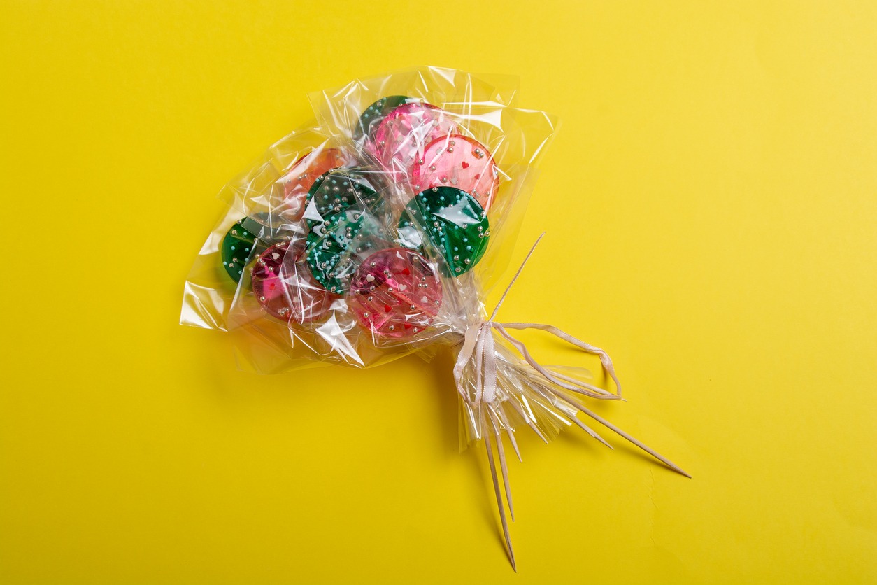 bouquet of lollipops on a yellow background