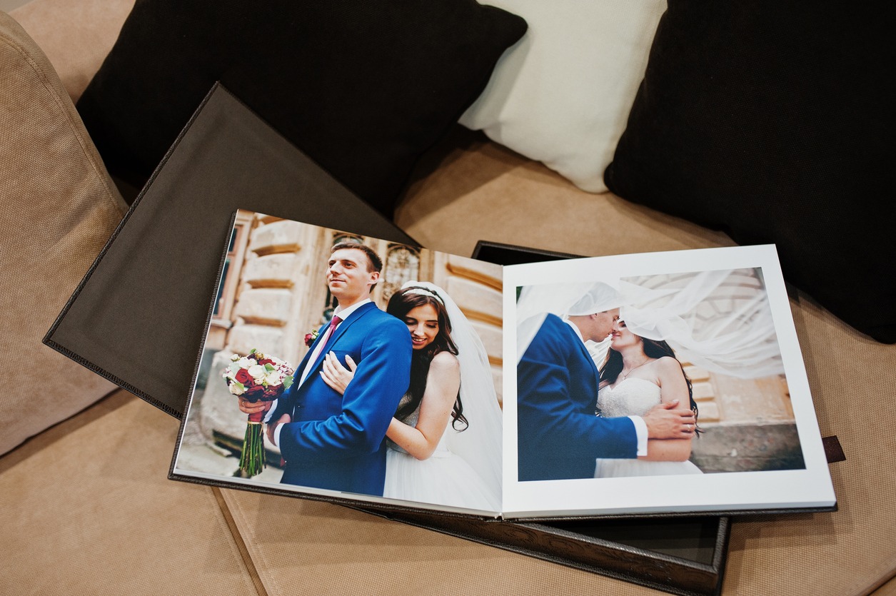 Open pages of brown luxury leather wedding book or album
