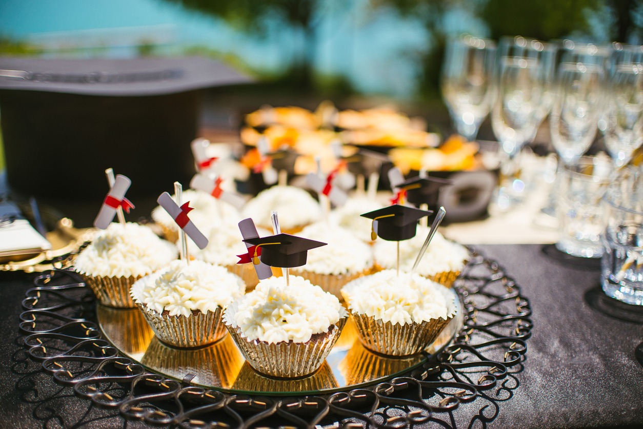 Cupcakes with graduation toppers served on the table 