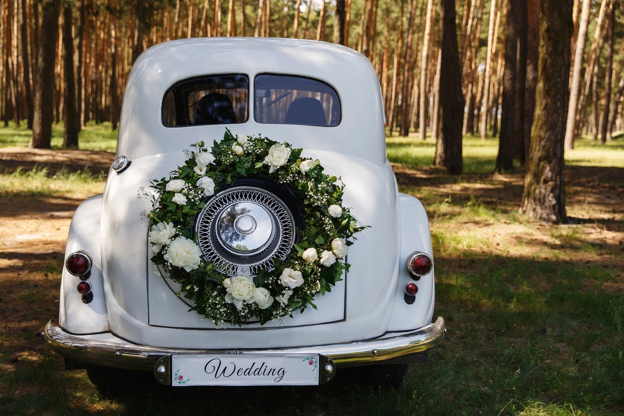 vintage wedding car with some wreaths and other vintage decorations