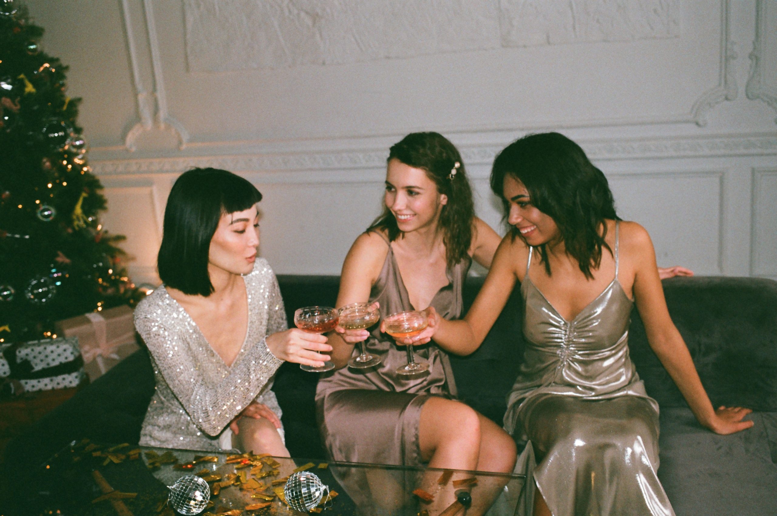 three women enjoying cocktails