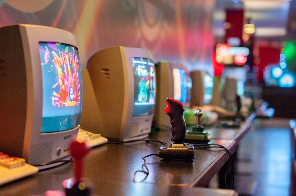 retro gamer party with vintage video game consoles