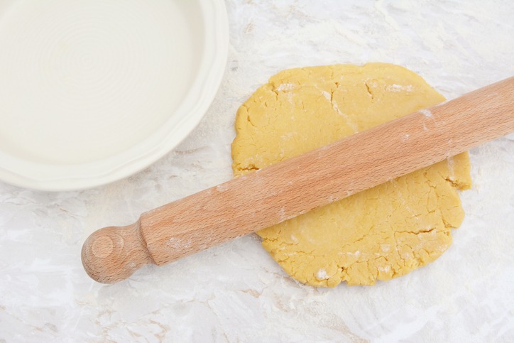 Rolling out homemade pastry with a rolling pin