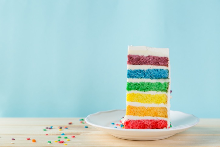 A slice of rainbow cake