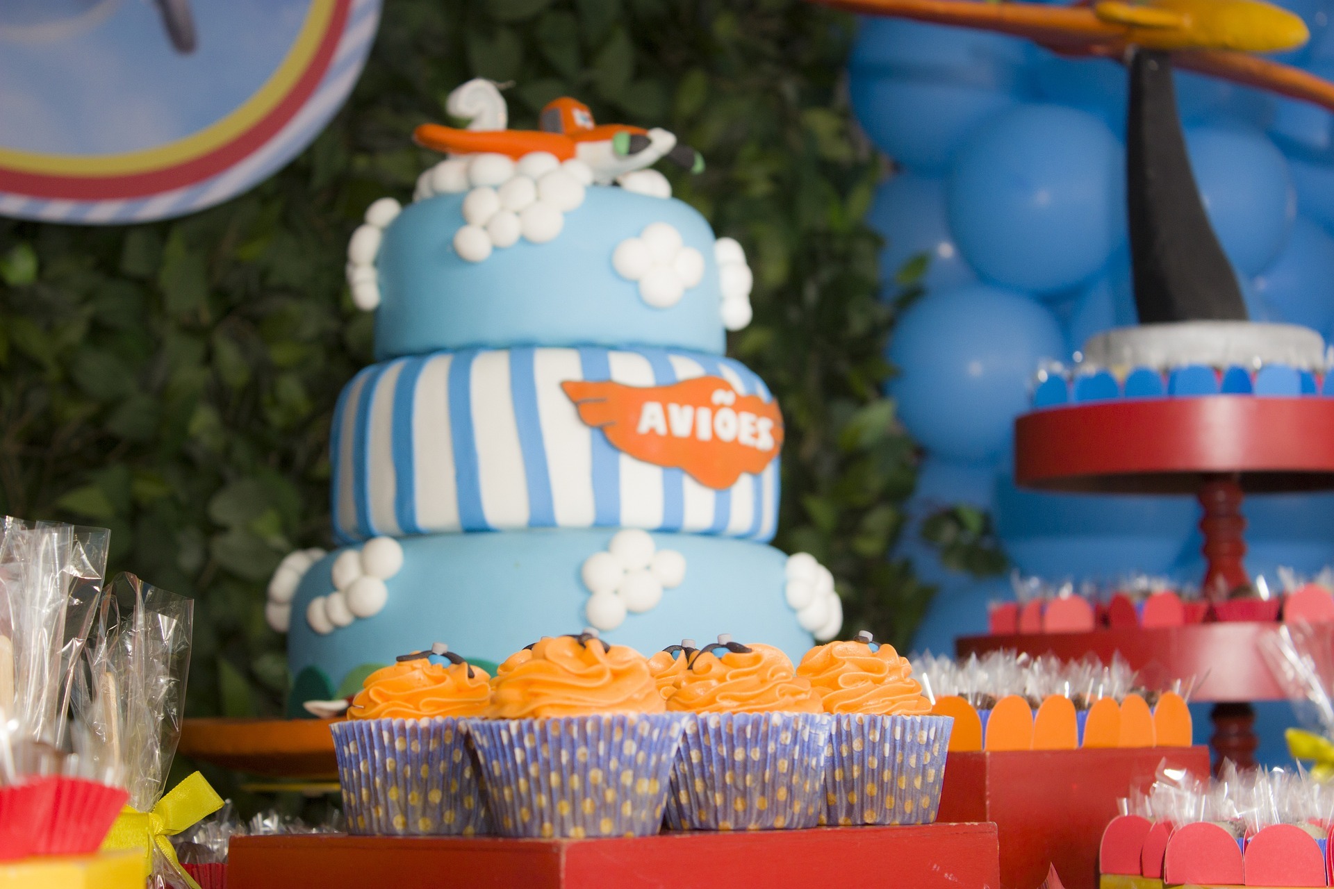 cupcakes and airplane themed birthday cake