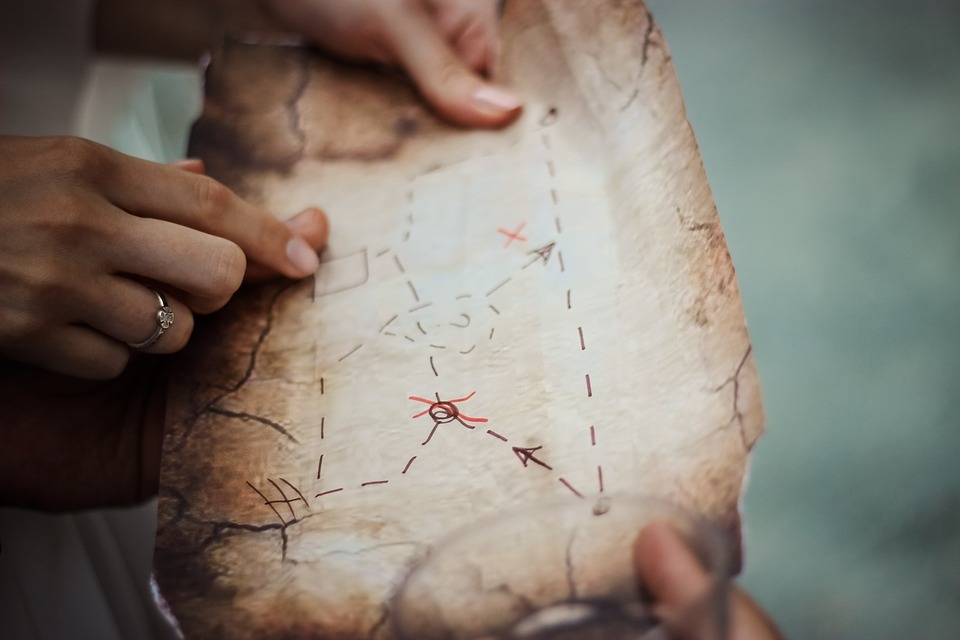 a person holding a treasure map