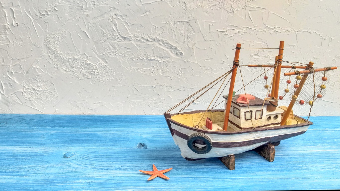 A-replica-of-a-fishing-boat-on-a-table
