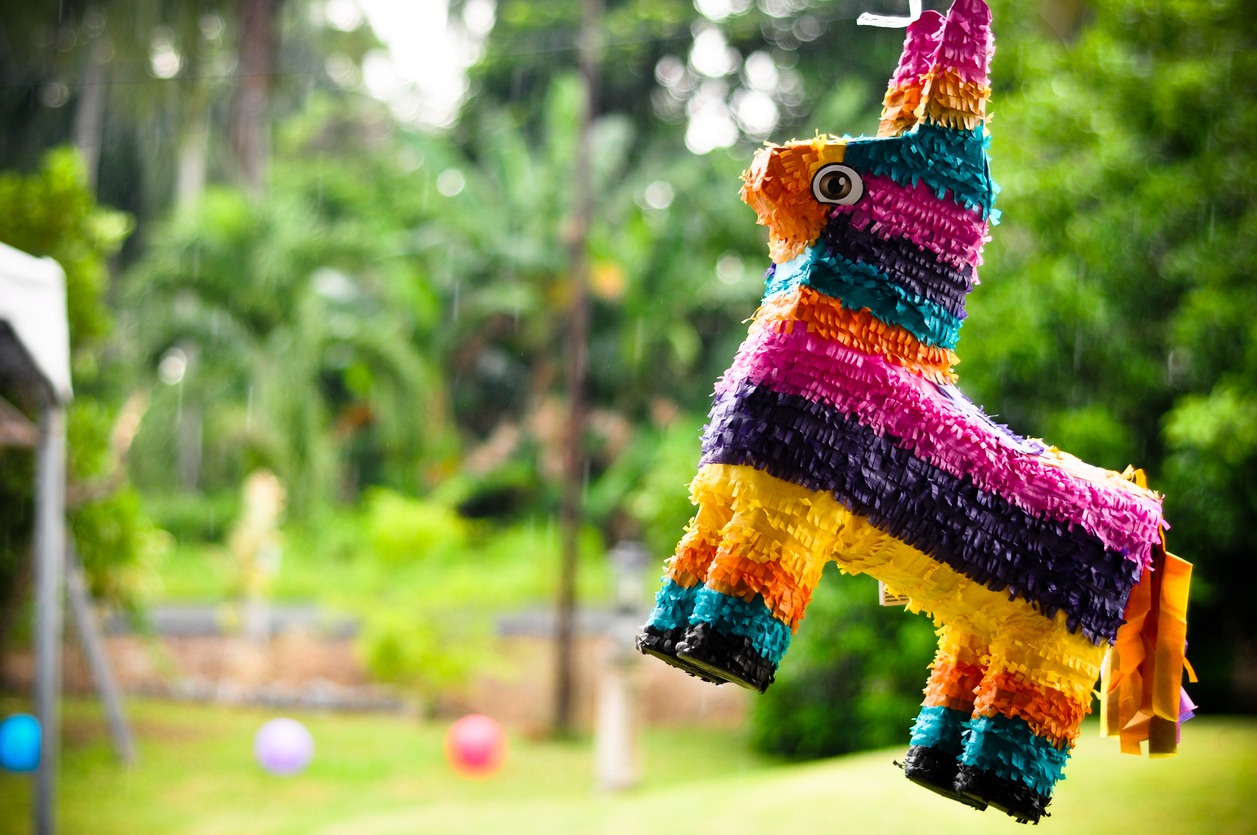 a colorful piñata hanging outside