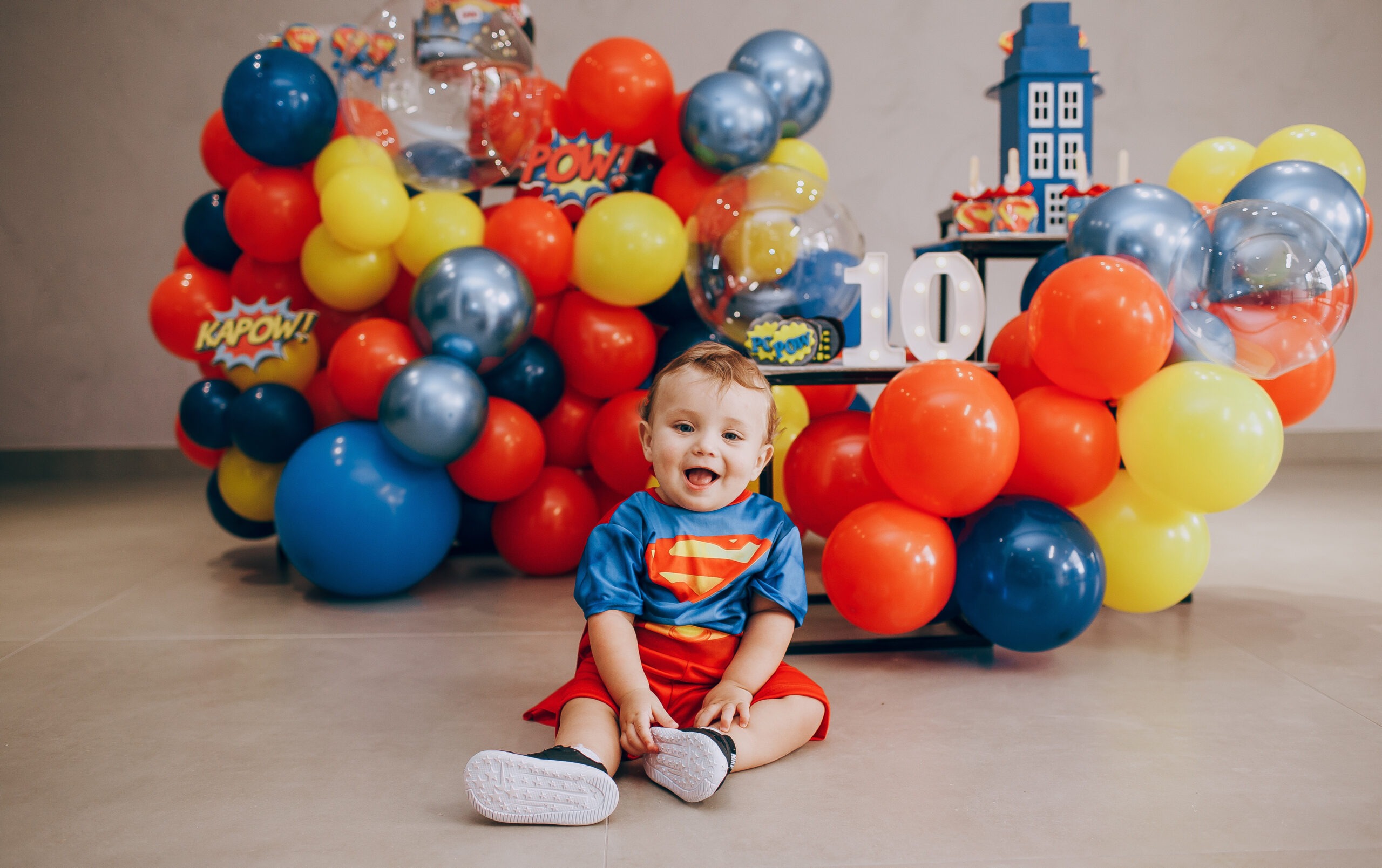 baby celebrating a Superman themed party