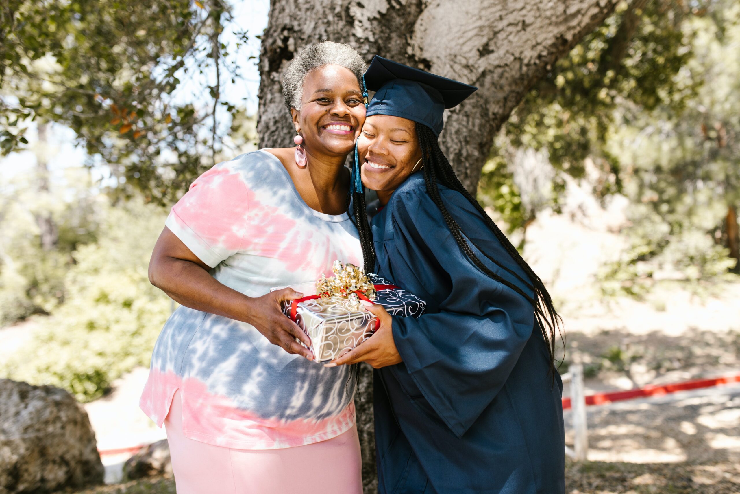 picture of a graduate hugging her mother 