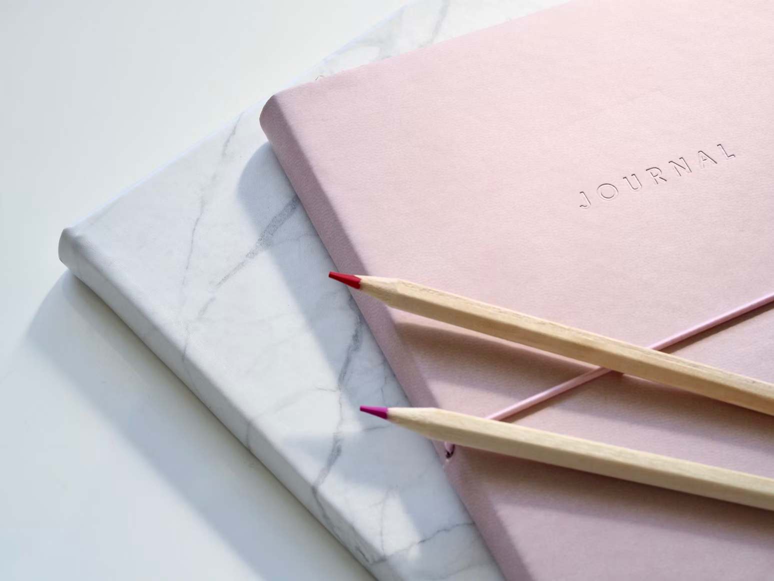 Pencils on top of journal