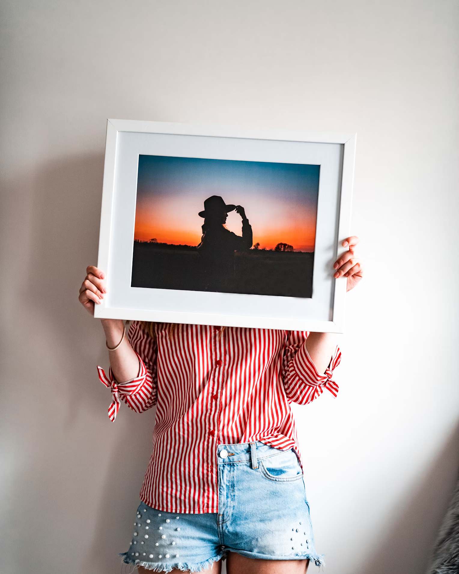 Woman holding a framed photo